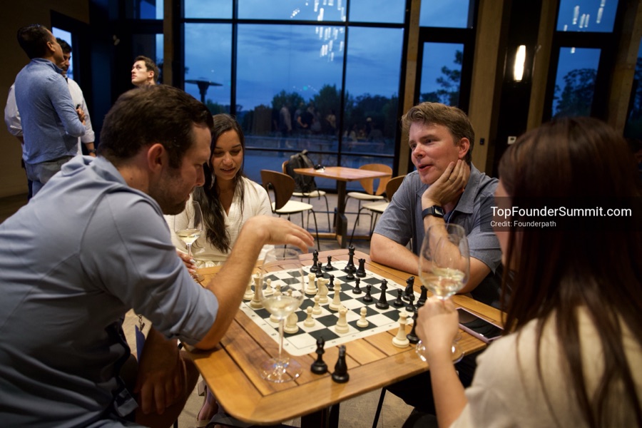 Founders playing poker, Catan and chess at Games Night, Top Founders Summit Napa 2026