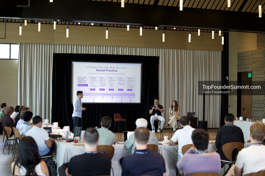 Founders on the main stage and in the audience during the opening keynotes at Glass House, Top Founders Summit Napa 2026